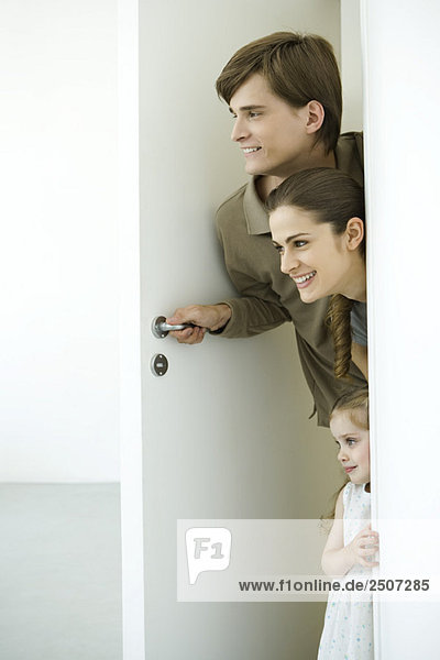 Family peeking in doorway