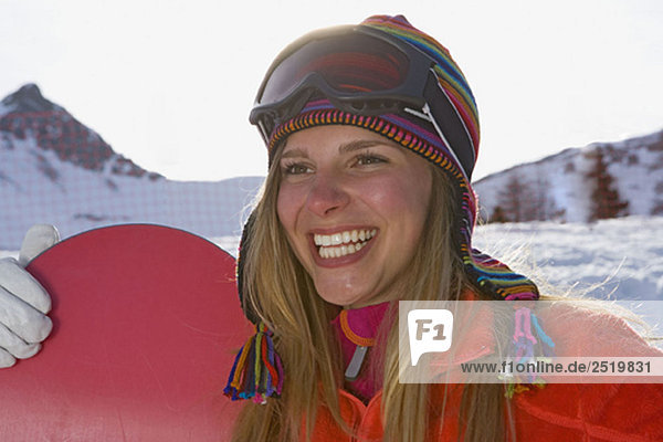 Girl ski smiling with ski board