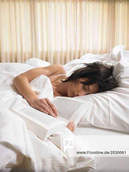 Woman sleeping with an open book