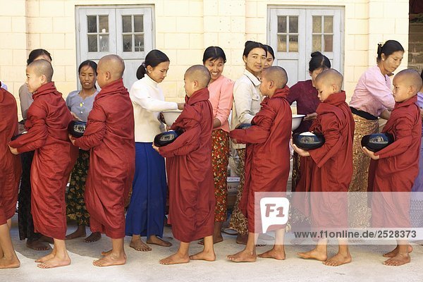 Young Monks Receiving Rice  Inle Lake  Myanmar (Burma)