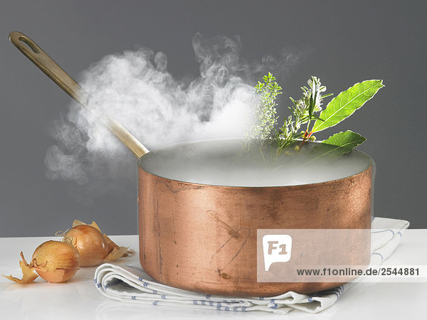 Copper saucepan with steam
