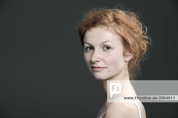Portrait of a young woman with red hair
