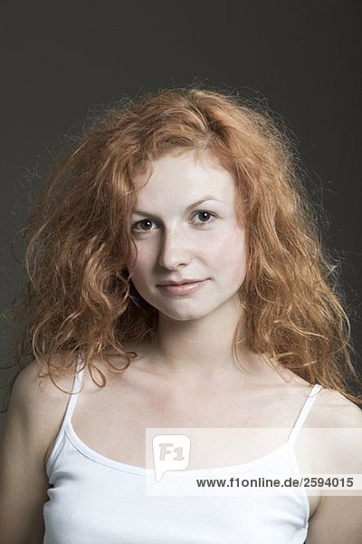 Portrait of a young woman with red hair
