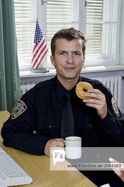 Police officer having a coffee break
