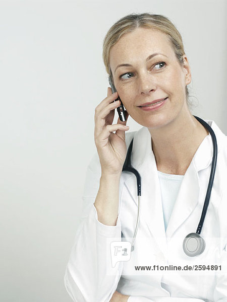 Portrait of a female doctor using a mobile phone