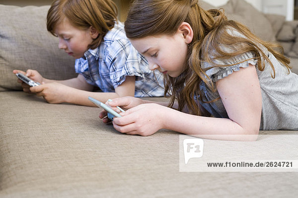 Girl and boy playing video games