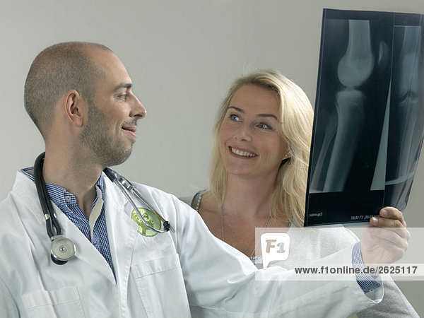 Doctor and woman with x-ray