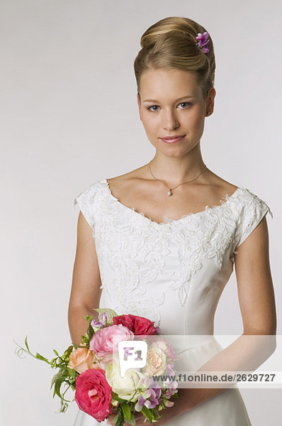 Young bride holding bridal bouquet  portrait