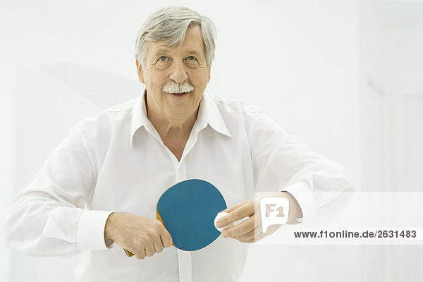 Senior man playing table tennis