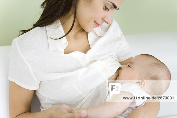 Mother breastfeeding baby  close-up