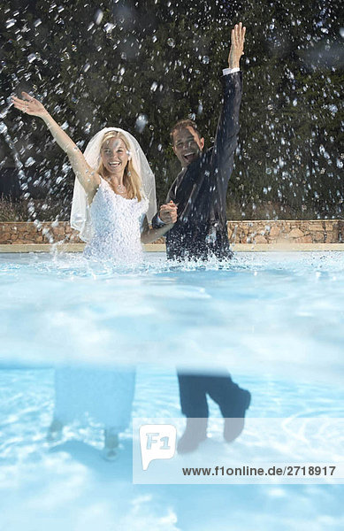 Bride and groom in pool
