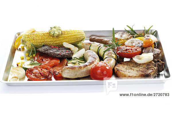 Grilled meat  sausage and vegetables on tray