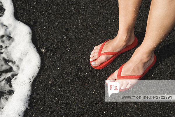 Spain  Lanzarote  Feet on lava sand  elevated view