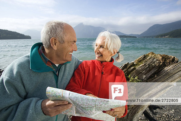 Germany  Bavaria  Walchensee  Senior couple looking at map