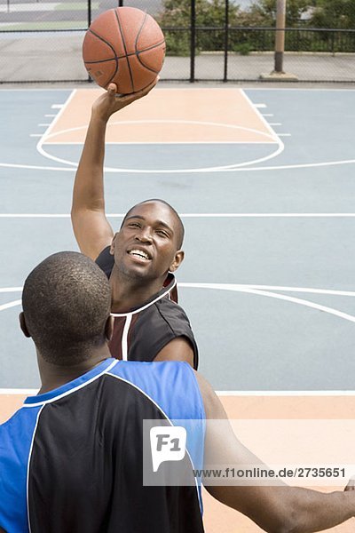 A basketball player preparing to make a shot