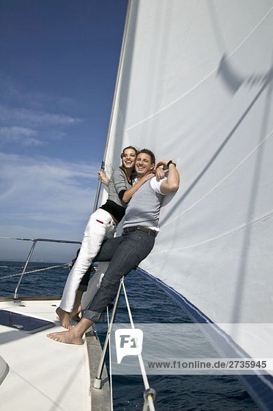 A couple embracing on a yacht