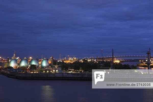 Digestion towers lit up at night  Koehlbrand Bridge  Hamburg  Germany