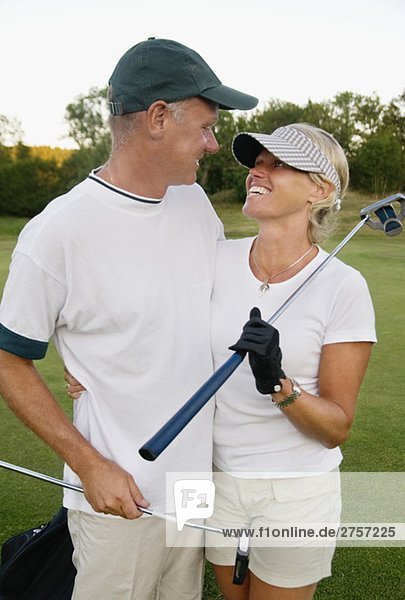Couple on gollf course