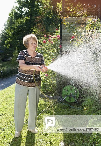 Woman with water hose