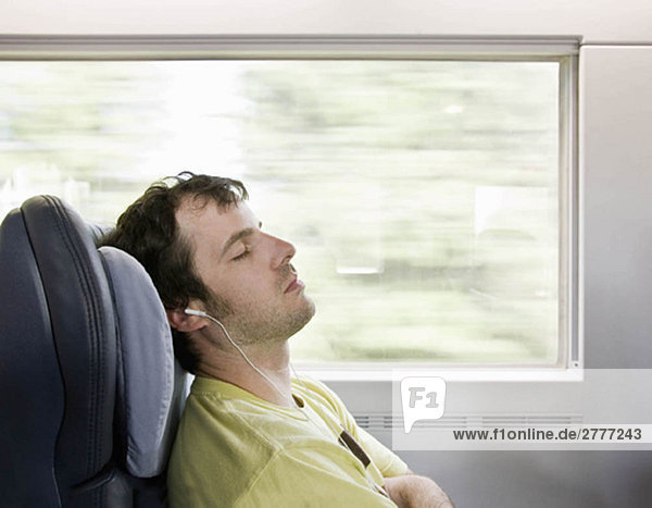 Man sleeping on moving train
