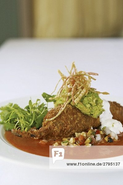 Chile Relleno filled with Prawns and Scallops and topped with Corn Relish and Guacamole
