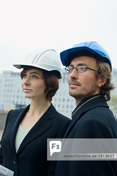 Project leaders at a building site a man and a woman Sweden.