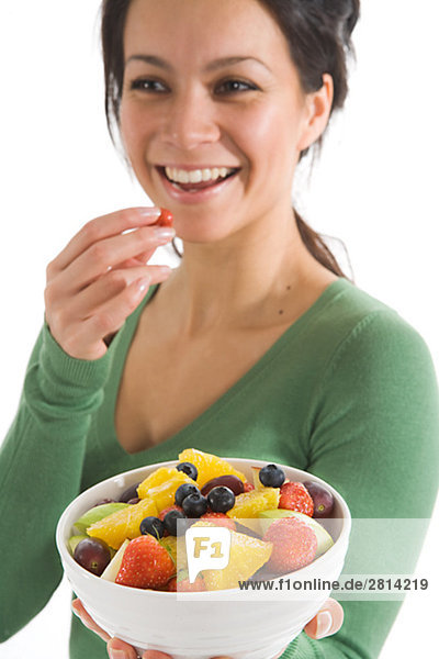 A woman eating fruit Sweden.