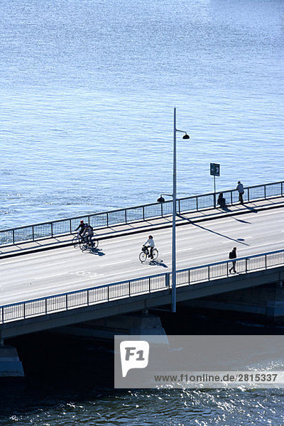 Cyclists passing by on Strombron Stockholm Sweden.