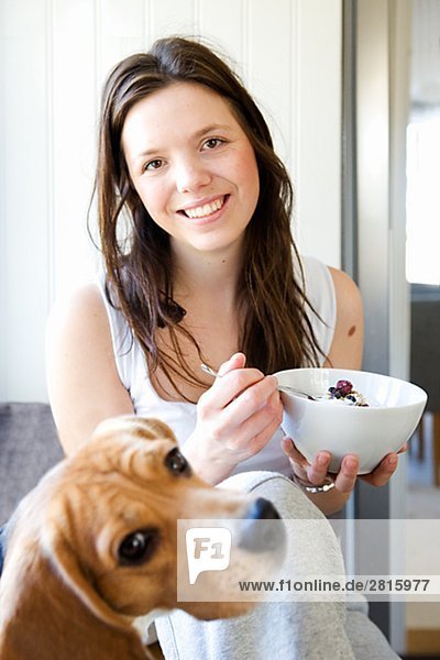 A young woman having breakfast Sweden.
