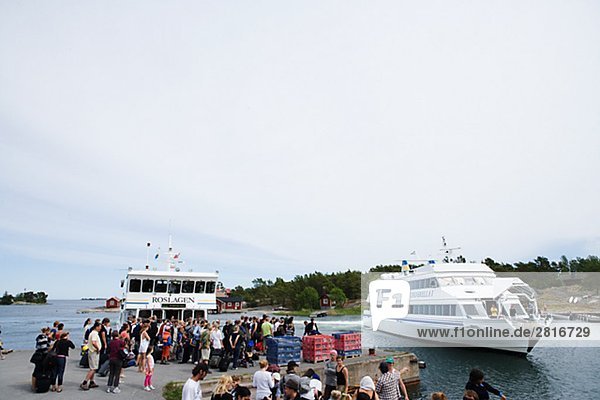 People waiting for a boat in the archipelago Sweden.