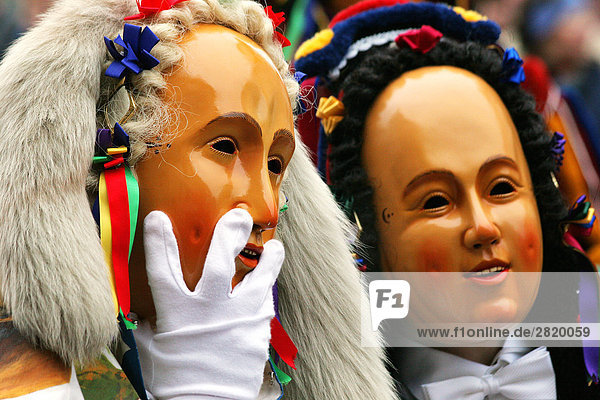 People wearing carnival masks on his head in alemannic shrove tuesday  Fastnacht  Rottweil  Baden-Wurttemberg  Germany