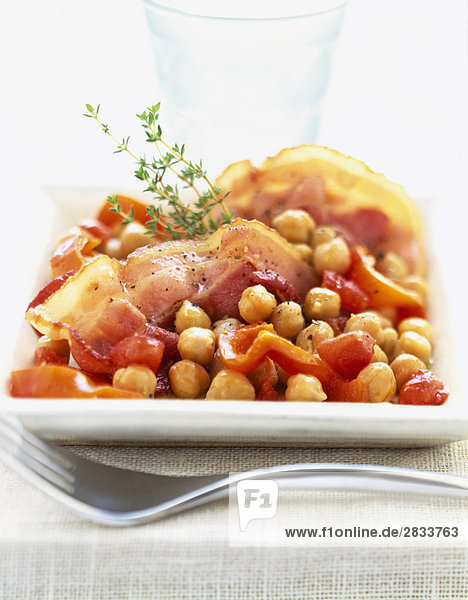 Chickpeas cooked with diced bacon and peppers