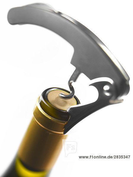 Openning a bottle of wine with a corkscrew