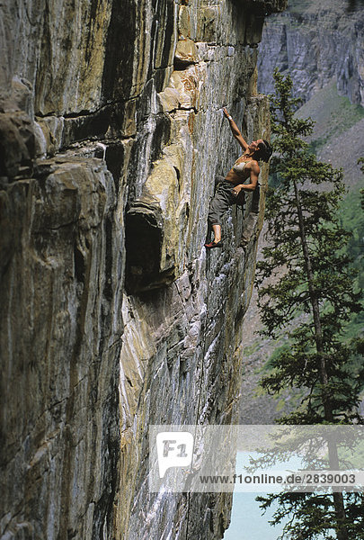 Female climbing Mistaya  'Back of the Lake'  Lake Louise  Banff National Park  Alberta  Canada.