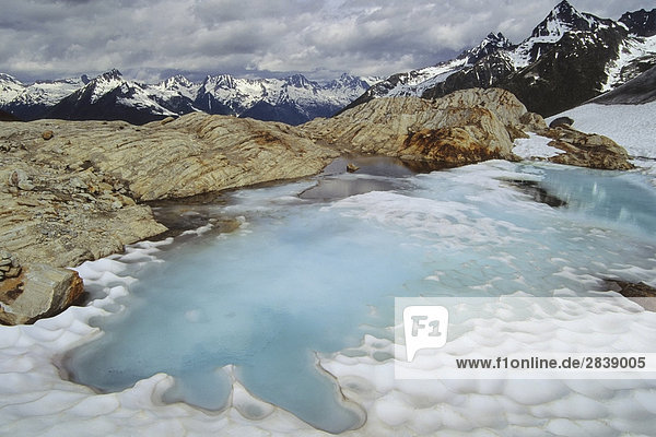 A small glacial tarn at the foot of the Illicillawaet Glacier  Glacier National Park  British Columbia  Canada.