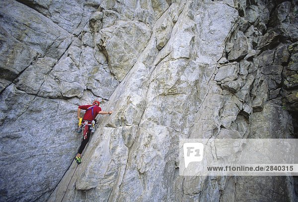 Man climbing Double Exposure at Skaha Bluffs Penticton  British Columbia  Canada.