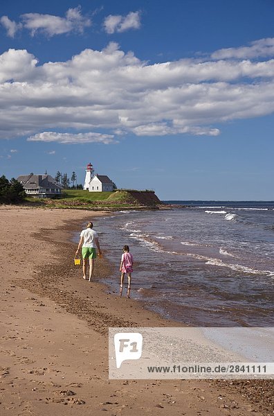 Young woman with daughter explore beach on Panmure Island  Points East Scenic Route  Prince Edward Island  Canada.