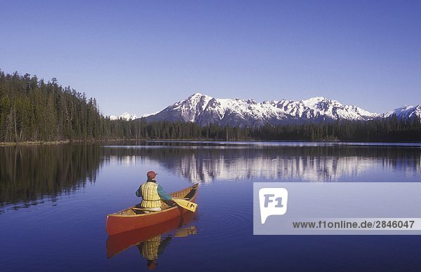canoeing on Wilderness Lake  Chilcotin region  British Columbia  Canada.