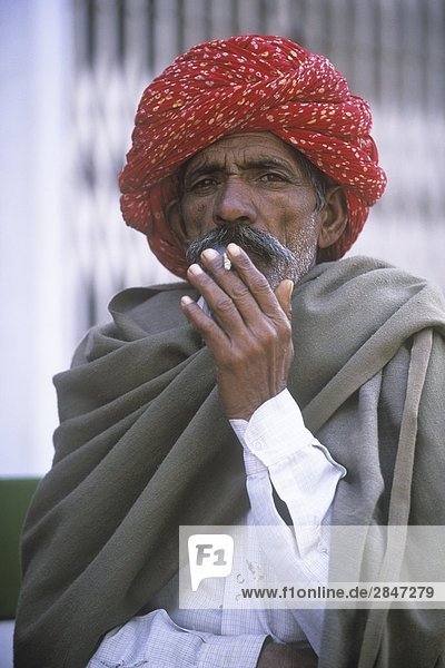 India  Rajastan  Samode Village  man with colorful turban smoking