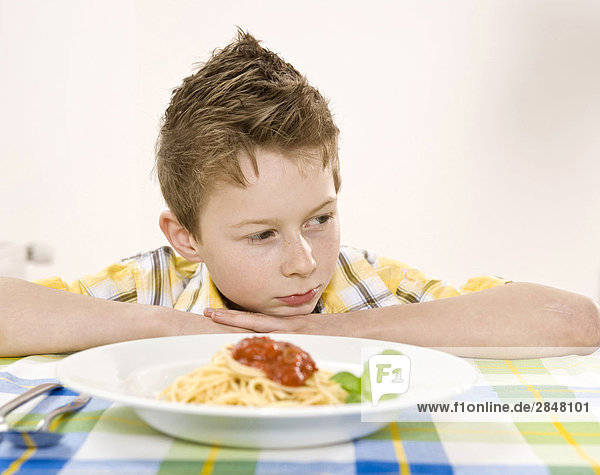 Noodles in front of boy