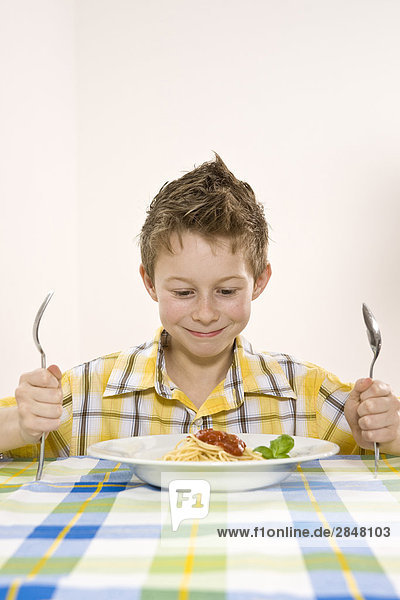 Boy having noodles