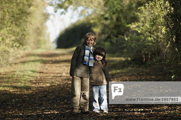 Two boys on country lane