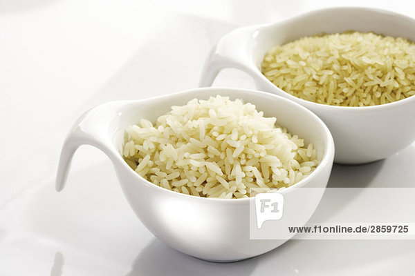 Sorts of Rice in bowls  raw and cooked