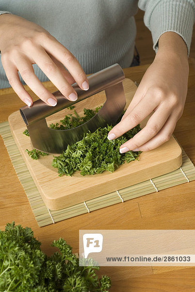 Person cutting parsley  elevated view