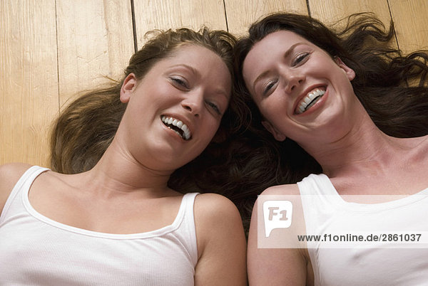 Two young women  smiling  portrait