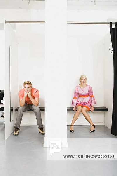 Couple sitting in fitting room