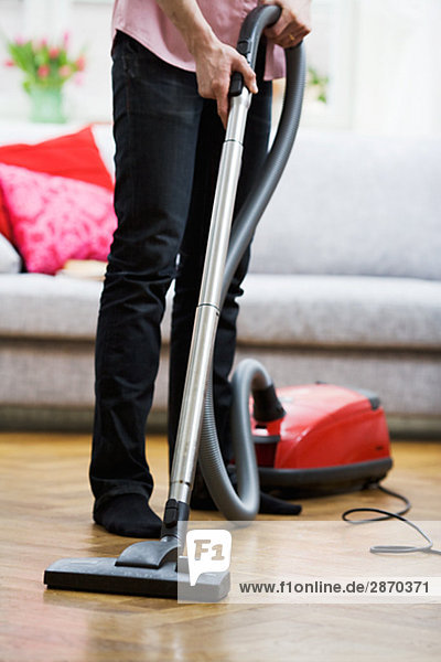 A man vacuuming Sweden.