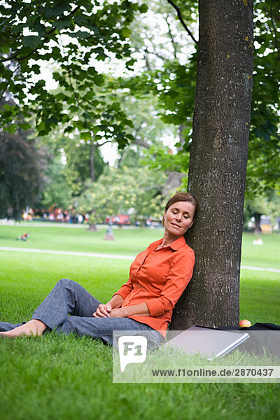 A woman resting in a park Sweden.