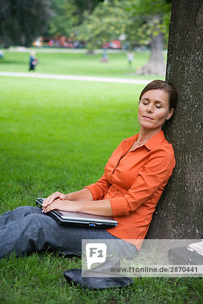 A woman resting in a park Sweden.