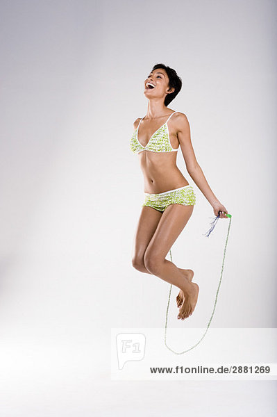 Woman skipping with a rope